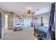 bedroom with carpeted floors, a ceiling fan and toy storage at 2744 Drummossie, Las Vegas, NV 89044