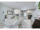 Bright dining room features a large table with white chairs, perfect for Gathering meals at 2744 Drummossie, Las Vegas, NV 89044