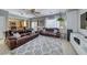 Living room with a large leather sectional and a view into the kitchen at 2744 Drummossie, Las Vegas, NV 89044