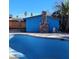 Large, kidney-shaped pool with surrounding patio area at 3011 Liberty Cir, Las Vegas, NV 89121