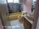 Bathroom with yellow bathtub, toilet and sink at 3011 Liberty Cir, Las Vegas, NV 89121