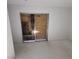 Bedroom with sliding glass door and plywood covering at 3011 Liberty Cir, Las Vegas, NV 89121