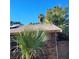 Rear view of the house, showcasing roof and landscaping at 3011 Liberty Cir, Las Vegas, NV 89121