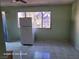 Kitchen with refrigerator, tiled floor, and large window at 3011 Liberty Cir, Las Vegas, NV 89121