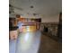 Kitchen and living area with tiled floor and rock fireplace at 3011 Liberty Cir, Las Vegas, NV 89121