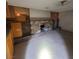 Kitchen with wooden cabinets and a rock fireplace at 3011 Liberty Cir, Las Vegas, NV 89121