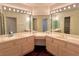 Large bathroom with a corner vanity and double sinks at 3012 Morning Ridge Dr, Las Vegas, NV 89134