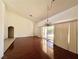 Sunlit dining room with hardwood floors and chandelier at 3012 Morning Ridge Dr, Las Vegas, NV 89134