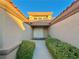 Inviting entryway with a white door and lush landscaping at 3012 Morning Ridge Dr, Las Vegas, NV 89134