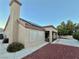 Home exterior showcasing a covered patio and landscaping at 3012 Morning Ridge Dr, Las Vegas, NV 89134