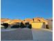 Single-story house with a two-car garage and desert landscaping at 3012 Morning Ridge Dr, Las Vegas, NV 89134