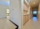 Hallway with light wood cabinets and tile flooring at 3012 Morning Ridge Dr, Las Vegas, NV 89134