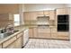 Well-equipped kitchen with granite countertops and stainless steel appliances at 3012 Morning Ridge Dr, Las Vegas, NV 89134