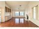 Bright living room featuring hardwood floors, a fireplace, and built-in shelving at 3012 Morning Ridge Dr, Las Vegas, NV 89134