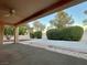 Covered patio with ceiling fan, overlooking a landscaped backyard at 3012 Morning Ridge Dr, Las Vegas, NV 89134