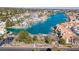 Panoramic aerial shot of a lake community featuring luxurious waterfront homes with boat docks and lush landscaping at 3173 Lido Isle Ct, Las Vegas, NV 89117