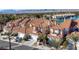 This is an aerial view of the home, showcasing the terra cotta roof and lake view at 3173 Lido Isle Ct, Las Vegas, NV 89117