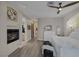 Bright bedroom featuring a fireplace, hallway, and white dresser at 3173 Lido Isle Ct, Las Vegas, NV 89117