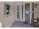 Bright entryway with a wooden door and decorative mirror at 3173 Lido Isle Ct, Las Vegas, NV 89117