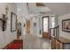 Spacious entryway with wooden door and red bench at 3173 Lido Isle Ct, Las Vegas, NV 89117