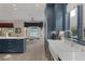 Spacious kitchen boasts modern cabinetry, quartz countertops, and a farmhouse sink at 3173 Lido Isle Ct, Las Vegas, NV 89117