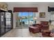 Living room with water views and wine storage at 3173 Lido Isle Ct, Las Vegas, NV 89117