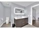 Modern bathroom with double vanity and updated fixtures at 3380 Shallow Pond Dr, Las Vegas, NV 89117