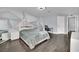 Modern bedroom with geometric accent wall and large window at 3380 Shallow Pond Dr, Las Vegas, NV 89117