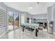 Bright dining area with sliding glass doors leading to a patio at 3380 Shallow Pond Dr, Las Vegas, NV 89117