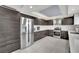 Modern kitchen with stainless steel appliances and dark wood cabinets at 3380 Shallow Pond Dr, Las Vegas, NV 89117