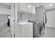 Convenient laundry room with washer, dryer, and utility sink at 3380 Shallow Pond Dr, Las Vegas, NV 89117