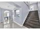 Elegant staircase with dark wood treads and modern design at 3380 Shallow Pond Dr, Las Vegas, NV 89117