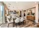 Bright dining room featuring a glass table and modern lighting at 3615 Bitonto Ln, Henderson, NV 89044