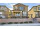 Two-story house with brown exterior, gray shutters, and a small front yard at 3615 Bitonto Ln, Henderson, NV 89044