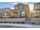 Two-story house with brown exterior, gray shutters, and a small front yard at 3615 Bitonto Ln, Henderson, NV 89044