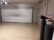 Attached garage with epoxy flooring and water softener at 3615 Bitonto Ln, Henderson, NV 89044