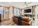 Spacious living room featuring a fireplace and leather sofa at 3615 Bitonto Ln, Henderson, NV 89044