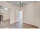 Bedroom with mirrored closet doors and wood-look floors at 3790 Morning Canyon St, Las Vegas, NV 89147