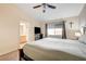 King-size bed in bedroom with ensuite bathroom and a large TV at 3790 Morning Canyon St, Las Vegas, NV 89147