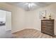 Bright bedroom with wood-look floors and a dresser at 3790 Morning Canyon St, Las Vegas, NV 89147