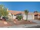 Single-story home with a two-car garage and desert landscaping at 3790 Morning Canyon St, Las Vegas, NV 89147