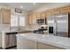 Modern kitchen featuring stainless steel appliances and light wood cabinets at 3790 Morning Canyon St, Las Vegas, NV 89147