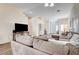 Living room with sectional sofa and view into entryway at 3790 Morning Canyon St, Las Vegas, NV 89147