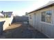 Gravel backyard with a block wall at 3886 Via Lucia Dr, Las Vegas, NV 89115