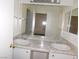 Bright bathroom with double sinks and a large mirror at 3886 Via Lucia Dr, Las Vegas, NV 89115