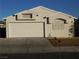 Front view of a single-story house with attached garage and small front yard at 3886 Via Lucia Dr, Las Vegas, NV 89115