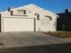 One-story house with attached two-car garage and desert landscaping at 3886 Via Lucia Dr, Las Vegas, NV 89115