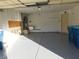 Garage with storage cabinets and epoxy floor at 3886 Via Lucia Dr, Las Vegas, NV 89115