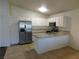 Kitchen with white cabinets, stainless steel appliances, and granite countertops at 3886 Via Lucia Dr, Las Vegas, NV 89115