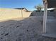 Low-maintenance backyard featuring gravel landscaping, a privacy wall, and a covered patio area at 4636 Ferrell St, North Las Vegas, NV 89031